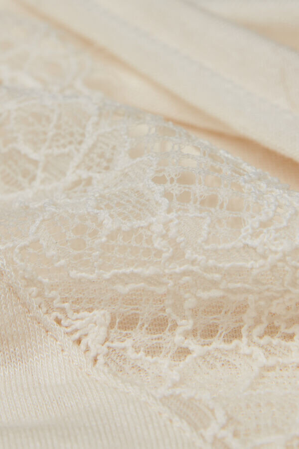 Långärmad bodysuit i ultralätt modal med kashmir och spets Långärmad bodysuit i ultralätt modal med kashmir och spets